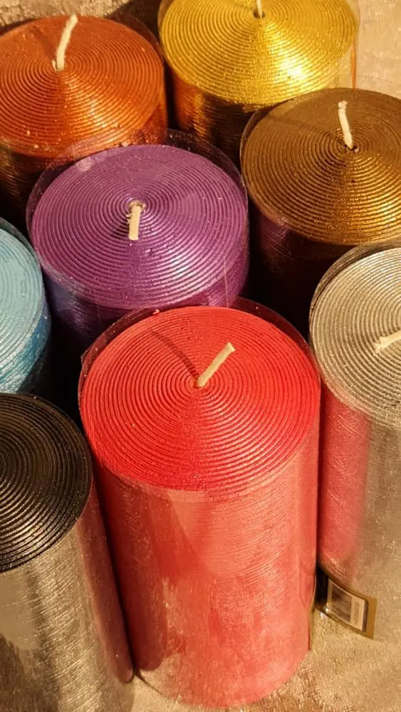 some colorful pillar candles close together