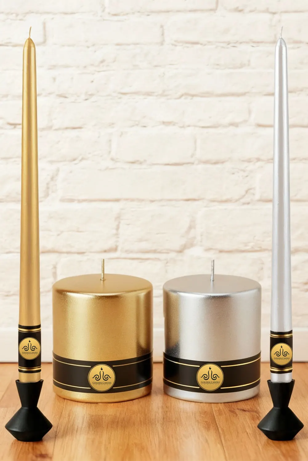 a taper and apillar golden candels and ataper and pillar silver candles next together an wight wall and wooden ground